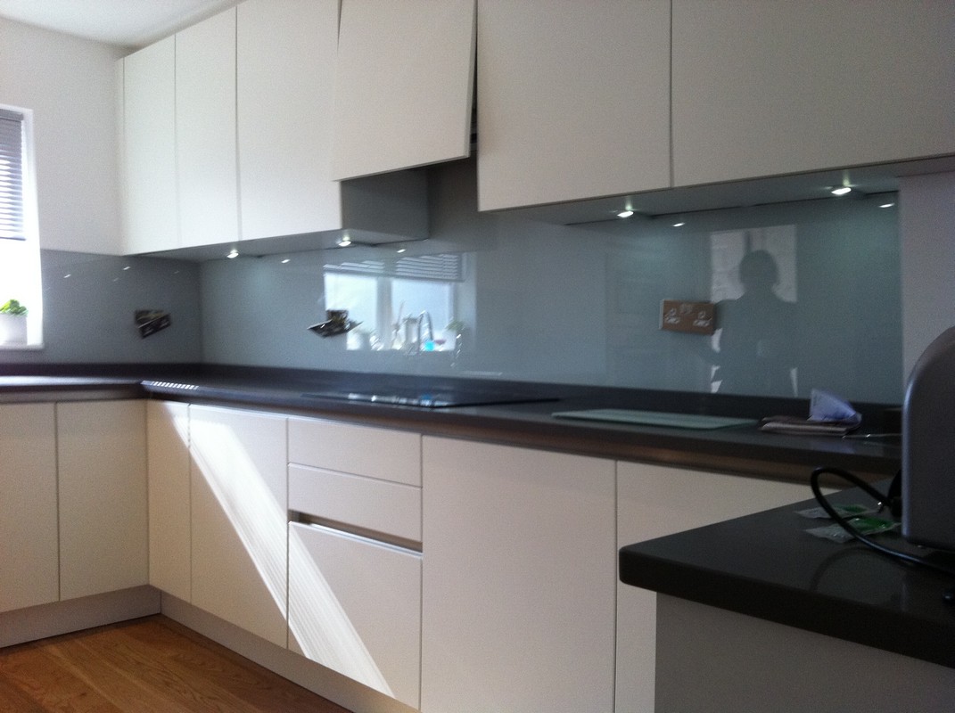 Grey glass kitchen splashback with LED lighting in Archway