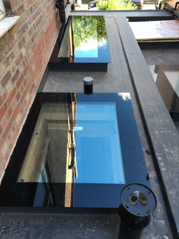Multiple flat roof skylights on extension in Archway