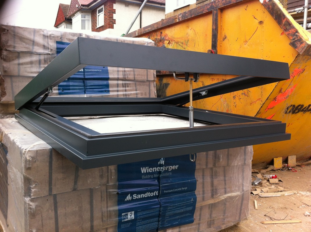 Opening flat roof skylight in anthracite grey installed in Archway